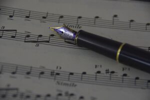 The Rhythm of the Pen: The Difference Between Writing Copy and Composing It